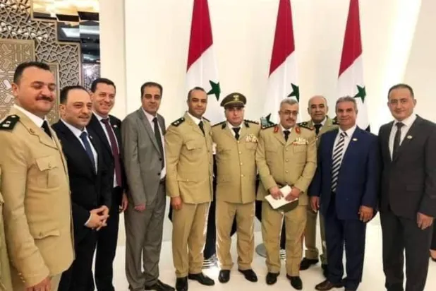 ‏العميد الركن غياث دلا قائد قوات الغيث (الثالث إلى من اليمين) من بين الحضور في أداء القسم الرئاسي صيف 2021