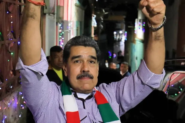 Venezuela Devlet Başkanı Nicolas Maduro, Karakas'ın San Agustin mahallesinde düzenlenen bir Noel kutlamasına katıldı (Reuters)