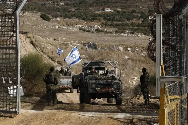 Israeli military vehicles return from the buffer zone with Syria, near the Druze village of Majdal Shams in the Golan Heights on Dec. 10, 2024. (AFP via Getty Images)