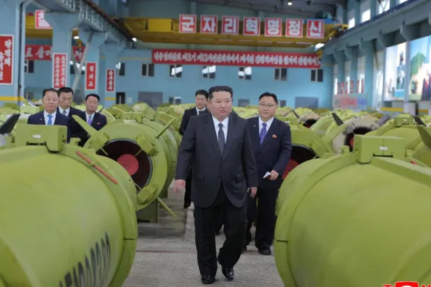 In a visit to munitions factories accompanied by top officials, the state-run Korean Central News Agency (KCNA) said Kim ordered the factories to prepare for a busy year ahead. STR / KCNA VIA KNS/AFP
