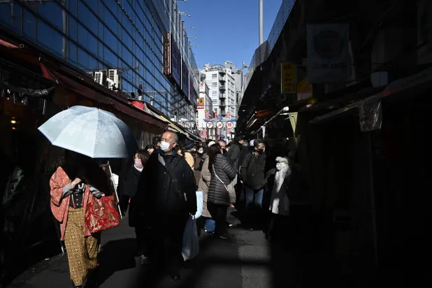 Year-end shoppers walk along at the Ameyoko shopping street ahead of the New Year in Tokyo, Japan, 26 December 2025. (EPA)