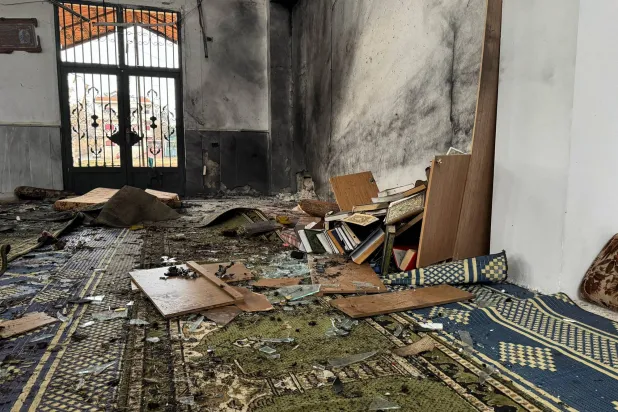 A view shows an interior of a damaged mosque after several people were killed in an explosion, as the Syrian Arab News Agency (SANA) said, in Homs, Syria December 26, 2025. REUTERS/Ali Ahmed al-Najjar 