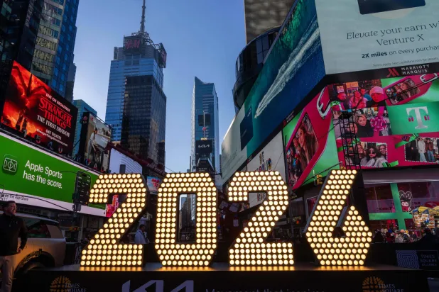 FILE - The 7-foot tall "2026" numerals are displayed at an illumination ceremony in Times Square, Thursday, Dec. 18, 2025, in New York. (AP Photo/Adam Gray, File)