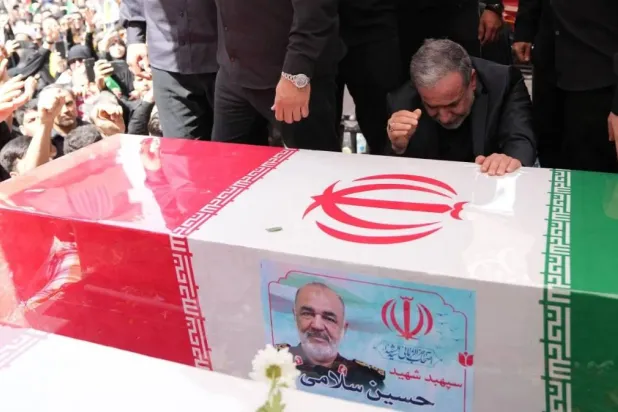 Iranian Foreign Minister Abbas Araghchi weeps over the coffin of Hossein Salami, commander of the Revolutionary Guard Corps, during the funeral of senior military officials killed in Israeli strikes in Tehran on June 28. AFP/Archive