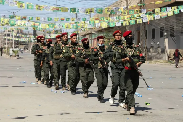 SDF fighters are seen at a military parade in Qamishli. (Reuters file)