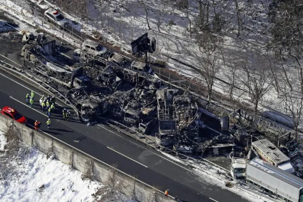  Burnt vehicles are seen after a massive crash on an expressway, in Minakami, northwest of Tokyo, Saturday, Dec. 27, 2025. (Kyodo News via AP) 