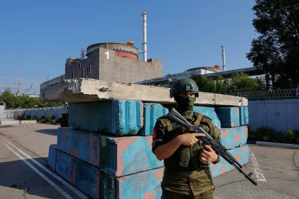 A Russian service member stands guard at a checkpoint near the Zaporizhzhia Nuclear Power Plant before the arrival of the International Atomic Energy Agency (IAEA) expert mission in the course of Russia-Ukraine conflict outside Enerhodar in the Zaporizhzhia region, Russian-controlled Ukraine, June 15, 2023. (Reuters)