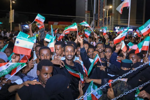 Residents wave Somaliland flags as they gather to celebrate Israel's announcement recognizing Somaliland's statehood in downtown Hargeisa, on December 26, 2025. (AFP)