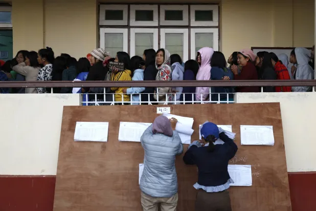 Myanmar voters line up to cast ballots during the first phase of general election at a polling station in Naypyitaw, the capital city of Myanmar, 28 December 2025. EPA/RUNGROJ YONGRIT