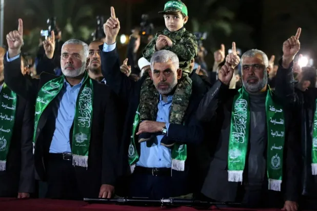 File photo dated 2017 shows Hamas leader in Gaza Yahya Sinwar alongside Ismail Haniyeh (Reuters)