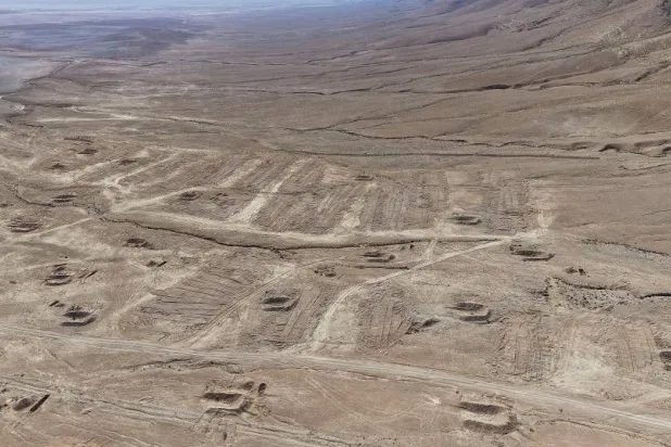 A drone view of the mass grave site in the desert near the eastern Syrian town of Dhumair, February 27, 2025. (Reuters)
