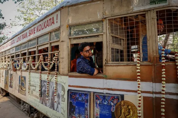 Passengers sit inside a decorated tram during the 152nd anniversary celebrations of trams in Kolkata, India, February 24, 2025. (Reuters)