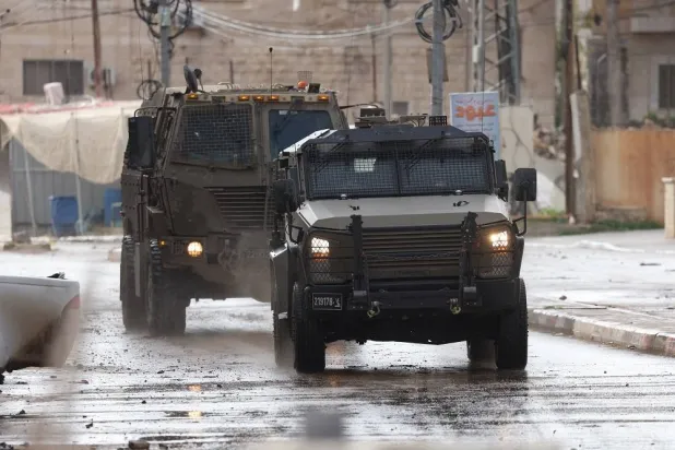 Israeli troops during a military operation in the Palestinian village of Qabatiya, near the West Bank city of Jenin, 27 December 2025. (EPA)
