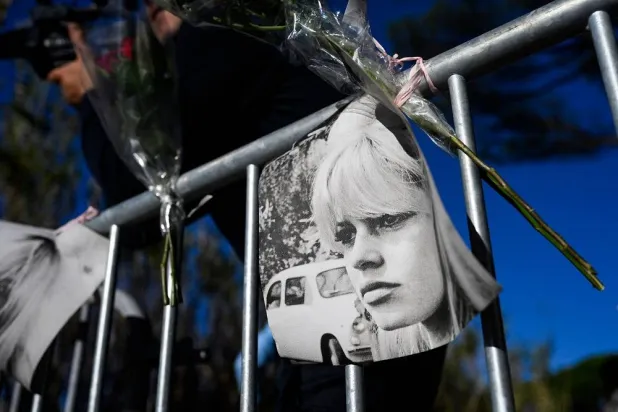 Portraits of late French actress Brigitte Bardot and flowers are displayed on barriers at the entrance of "La Madrague" house, property of late Brigitte Bardot in Saint-Tropez, southeastern France on December 28, 2025. (AFP)
