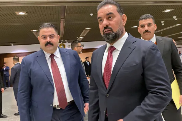  The new speaker of parliament Haibet Al-Halbousi, center, looks on before the start of their first legislative session in Baghdad, Iraq, Monday, Dec. 29, 2025. (AP Photo/Hadi Mizban)