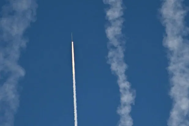 A rocket launches from Pingtan island in eastern China's Fujian province, the closest point to Taiwan. ADEK BERRY / AFP

