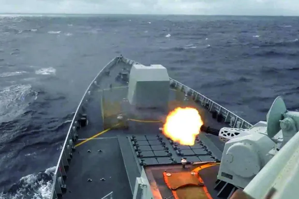 A ship fires a weapon during drills east of Taiwan, in this screenshot from a video released by the Eastern Theater Command of China's People's Liberation Army (PLA) on December 29, 2025. Eastern Theater Command/Handout via REUTERS 
