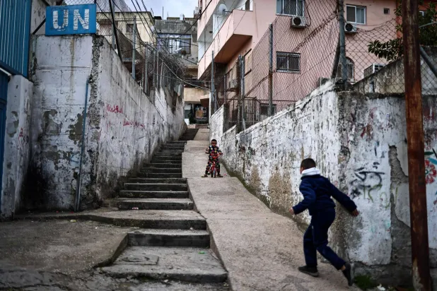 Children play at the Balata camp for Palestinian refugees, east of Nablus in the occupied West Bank on December 30, 2025. (AFP)