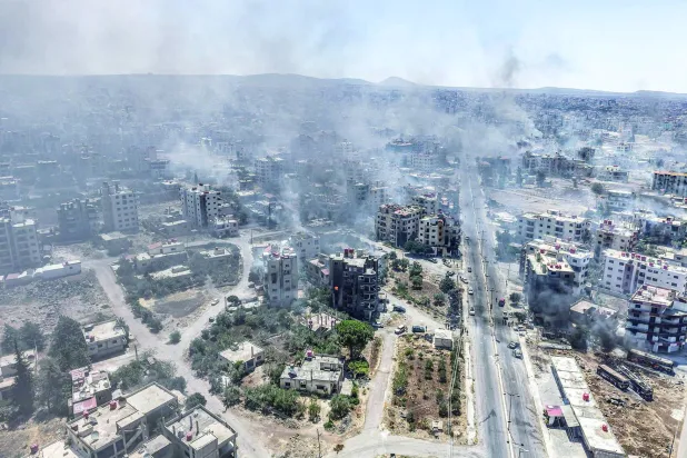 تصاعد الدخان جرّاء اشتباكات السويداء في يوليو الماضي (أرشيفية-د.ب.أ)