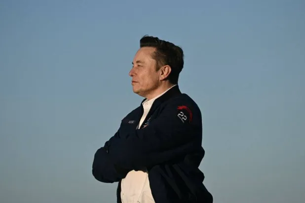 Elon Musk steps off Air Force One upon arrival at Morristown Municipal Airport in Morristown, New Jersey, US, March 22, 2025. (AFP)