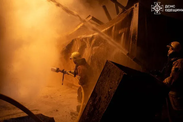In this handout photograph taken by the Ukrainian Emergency Service and released on January 1, 2025, Ukrainian firefighters extinguish a fire at the site following an air attack in Odesa region, amid the Russian invasion of Ukraine. (Photo by UKRAINIAN EMERGENCY SERVICE / AFP) 