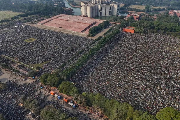 An aerial view shows mourners gathered for the funeral ceremony of Bangladesh's former Prime Minister Khaleda Zia at the Parliament House premises in Dhaka on December 31, 2025 a day after her death. (AFP)