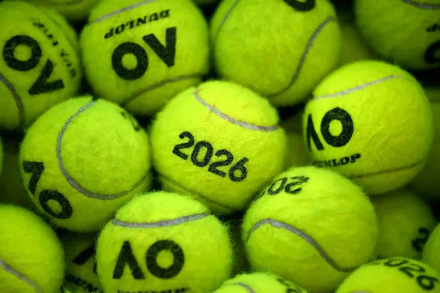 This picture shows tennis balls outside a court during a training session ahead of the United Cup tennis tournament in Sydney on January 2, 2026. (Photo by Saeed KHAN / AFP)