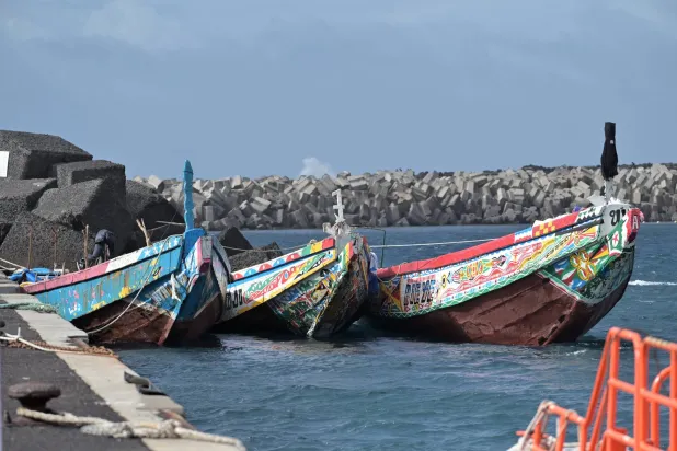 Three 'cayucos' (small wooden boats) moored after one of them, carrying 283 people of sub-Saharan origin, including 28 minors, arrived at La Restinga harbor in El Hierro island in the Canaries on 02 January 2026. EPA/GELMERT FINOL