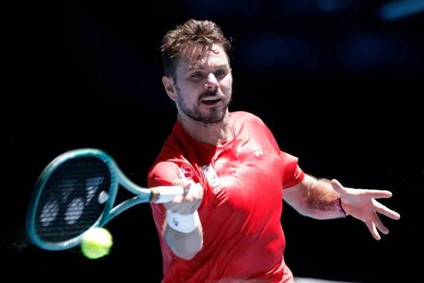 03 January 2026, Australia, Perth: Swiss tennis player Stan Wawrinka  in action against France's Arthur Rinderknech during their men's singles Group C match between Switzerland and France on day two of the United Cup tennis competition at RAC Arena in Perth. Photo: Richard Wainwright/AAP/dpa