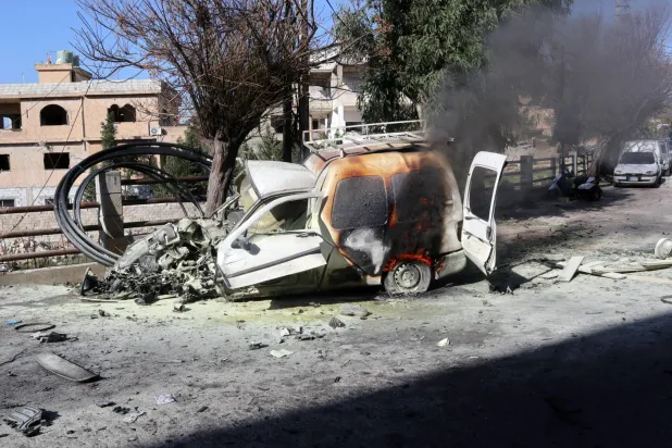 The wreckage of a car at the site after an Israeli strike on Al-Khiyam, in the Nabatieh governorate, southern Lebanon, 03 January 2026. (EPA)