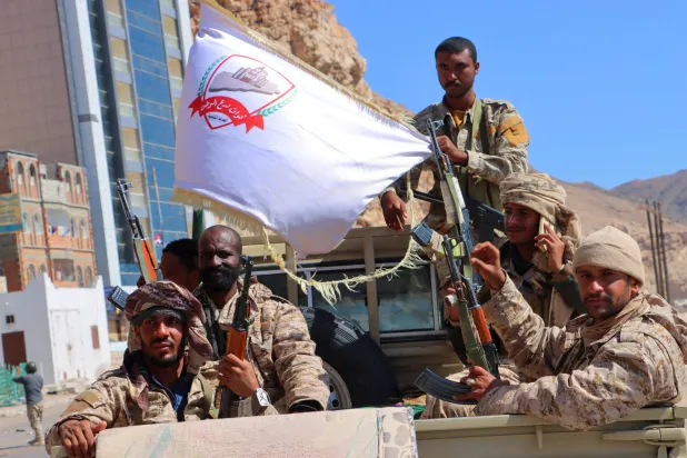 Government soldiers ride on the back of a pick-up truck in the Arabian Sea port city of Mukalla,Yemen January 4, 2026. (Reuters)