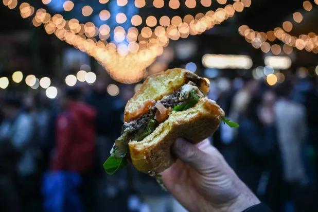 This photo illustration taken on December 18, 2025 shows a venison burger at a popular market in London. (Photo by JUSTIN TALLIS / AFP)