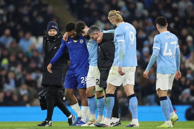 Josko Gvardiol of Manchester City leaves the pitch after sustaining an injury during the English Premier League match between Manchester City FC and Chelsea FC, in Manchester, Britain, 04 January 2026. (EPA)