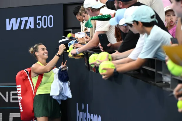 Aryna Sabalenka of Belarus celebrates winning with fans after her match against Cristina Bucsa of Spain during day three of the Brisbane International tennis tournament at Pat Rafter Arena in Brisbane, Australia, 06 January 2026.  EPA/DARREN ENGLAND