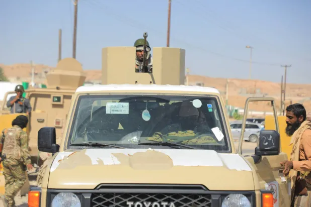 A government soldier mans a machine gun mounted on a pick-up truck in the Arabian Sea port city of Mukalla, Yemen January 4, 2026. (Reuters)