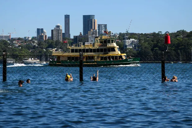 Swimmers at Marrinawi Cove in Sydney, Thursday, January 8, 2026. EPA/BIANCA DE MARCHI