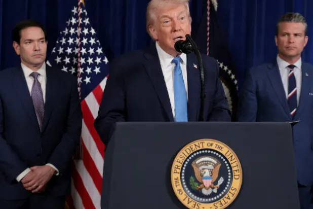 US President Donald Trump speaks as Secretary of State Marco Rubio and Secretary of Defense Pete Hegseth look on during a press conference following a US strike on Venezuela where President Nicolas Maduro and his wife, Cilia Flores, were captured, from Trump's Mar-a-Lago club in Palm Beach - Reuters