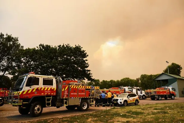 Smoke from the Longwood bushfire is seen at a staging area outside Seymour in central Victoria, Australia, Friday, Jan. 9, 2026. (Joel Carrett/AAP Image via AP) 