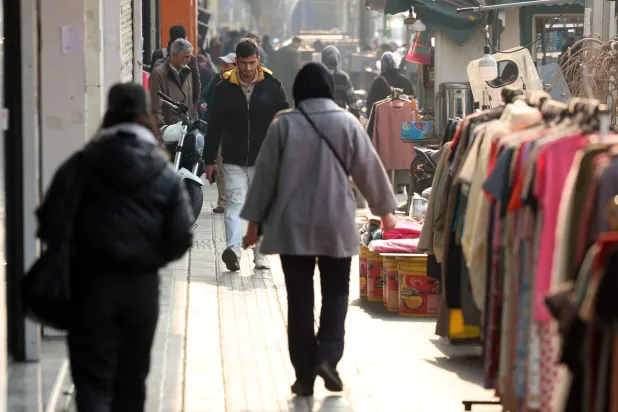 Iranians walk on a street in Tehran, Iran, 08 January 2026. (EPA)