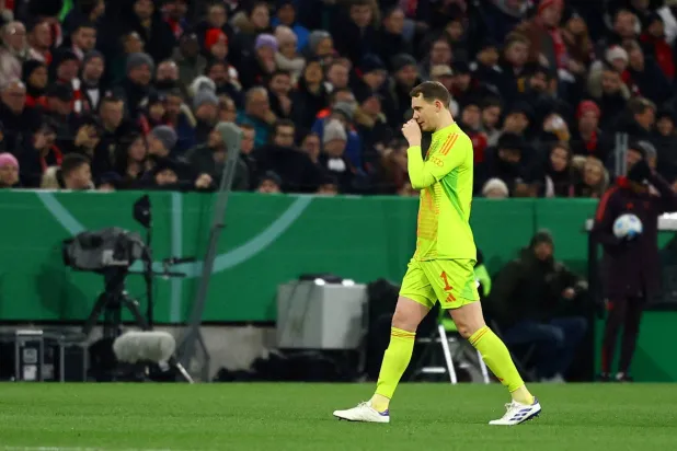 Football - DFB Cup - Round of 16 - Bayern Munich v Bayer Leverkusen - Allianz Arena, Munich, Germany - December 3, 2024 Bayern Munich's Manuel Neuer walks off the pitch after receiving a red card by referee Harm Osmers. (Reuters)