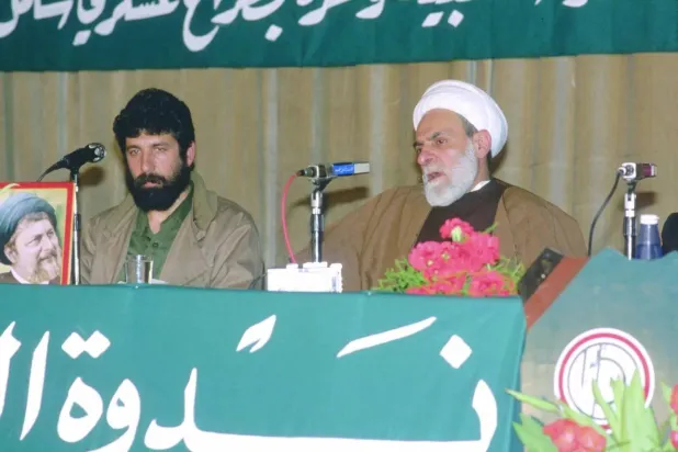 Sheikh Mohammad Mahdi Shamseddine during an event with Amal Movement military commander Akel Hamiyeh (Getty). 