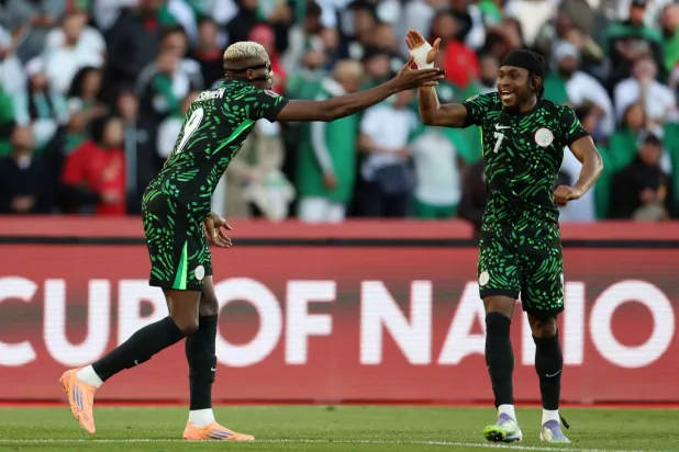  Soccer Football - CAF Africa Cup of Nations - Morocco 2025 - Quarter Final - Algeria v Nigeria - Grand Stadium of Marrakech, Marrakech, Morocco - January 10, 2026 Nigeria's Victor Osimhen celebrates scoring their first goal with Ademola Lookman. (Reuters)