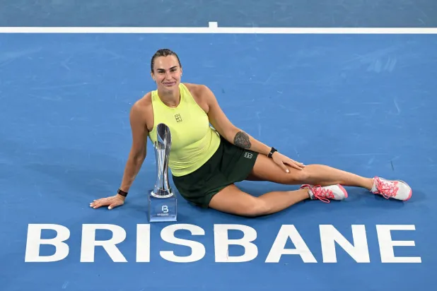 11 January 2026, Australia, Brisbane: Belarusian tennis player Aryna Sabalenka poses for photographs after winning the Women's Singles final tennis match against Ukraine's Marta Kostyuk at the Brisbane International tennis tournament at Pat Rafter Arena. Photo: Dave Hunt/AAP/dpa