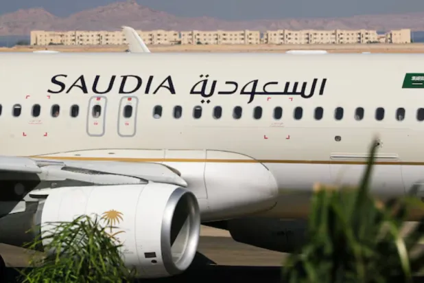 Saudi Arabian Airlines plane, is seen at the airport of the Red Sea resort of Sharm el-Sheikh, Egypt, August 9, 2021. Picture taken through a window. REUTERS/Mohamed Abd El Ghany/File Photo