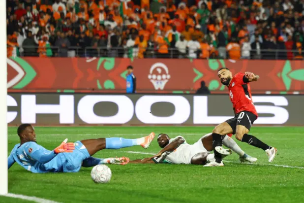 Soccer Football - CAF Africa Cup of Nations - Morocco 2025 - Quarter Final - Egypt v Ivory Coast - Adrar Stadium, Agadir, Morocco - January 10, 2026 Egypt's Mohamed Salah scores their third goal REUTERS/Siphiwe Sibeko 