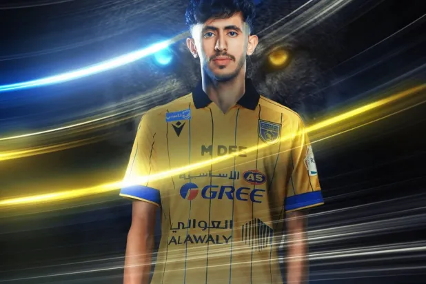 صورة بثها نادي التعاون بعد التوقيع مع القحطاني (موقع النادي)