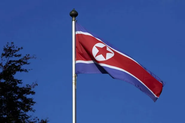 A North Korean flag flies on a mast at the Permanent Mission of North Korea in Geneva October 2, 2014. REUTERS/Denis Balibouse/File Photo
