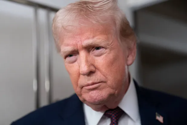 US President Donald Trump speaks with members of the media aboard Air Force One en route from Florida to Joint Base Andrews, Maryland, US, January 11, 2026. REUTERS/Nathan Howard
