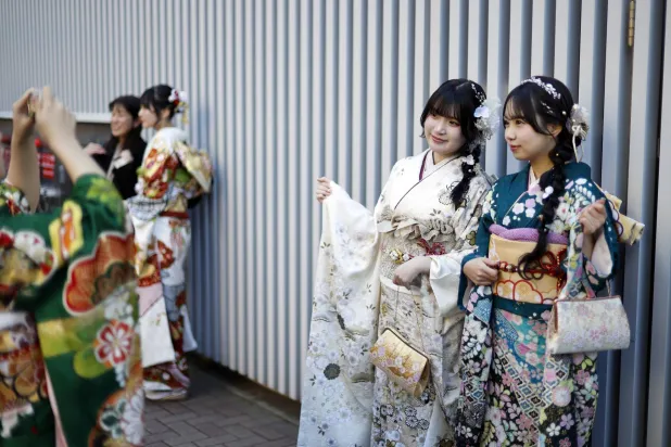 Kimono-clad Japanese young women take pictures after attending a Coming-of-Age Day ceremony in Yokohama, near Tokyo, Japan, 12 January 2026. EPA/FRANCK ROBICHON
