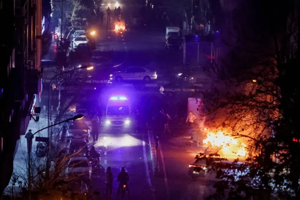  Cars burn in a street during a protest over the collapse of the currency's value, in Tehran, Iran, January 8, 2026. Stringer/WANA (West Asia News Agency) via Reuters